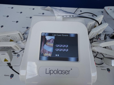 Zdjęcie przedmiotu: A cosmetic device that enables a procedure in which the cold diode laser penetrates into the subcutaneous layers and reduces the body circumference, stimulating the properties of fat cell membranes. STUDIO FIGURA Lipolaser