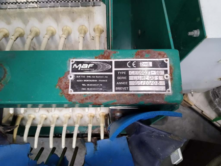 Zdjęcie przedmiotu: A line for the production of juices consisting of three units: sorting, grinding and squeezing juice as well as juice packaging and packing.