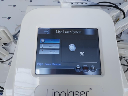 Zdjęcie przedmiotu: A cosmetic device that enables a procedure in which the cold diode laser penetrates into the subcutaneous layers and reduces the body circumference, stimulating the properties of fat cell membranes. STUDIO FIGURA Lipolaser